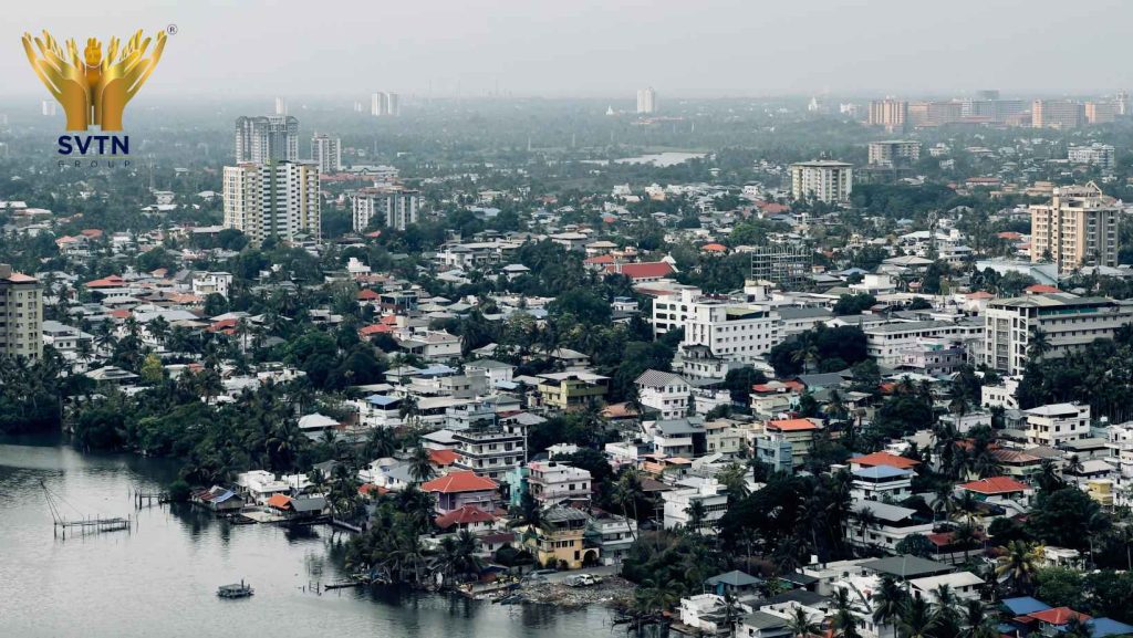 Aerial view of Pune residential neighborhoods showcasing modern homes, green surroundings, and developing infrastructure, highlighting the best areas in Pune for building a home.