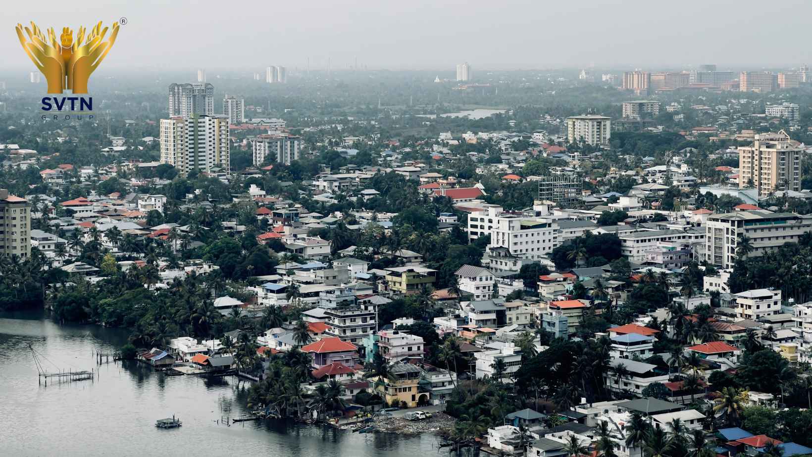 Aerial view of Pune residential neighborhoods showcasing modern homes, green surroundings, and developing infrastructure, highlighting the best areas in Pune for building a home.